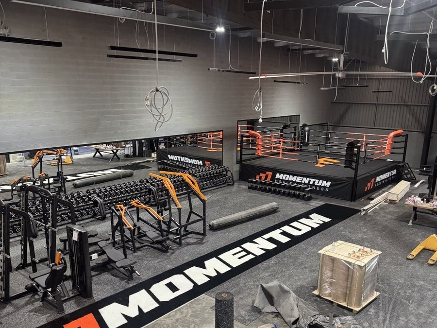 Momentum Health + Fitness during fit-out, flooring down and equipment being placed